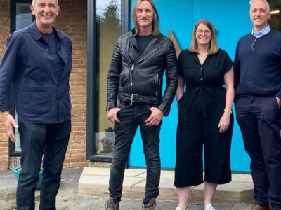 Claire Kemp and Howard Evans of CE+CA Architects in Sheffield with contractor Terry Huggett and TVs Kevin McCloud in front of multi-award winning retrofit project Ravine House in Derbyshire.