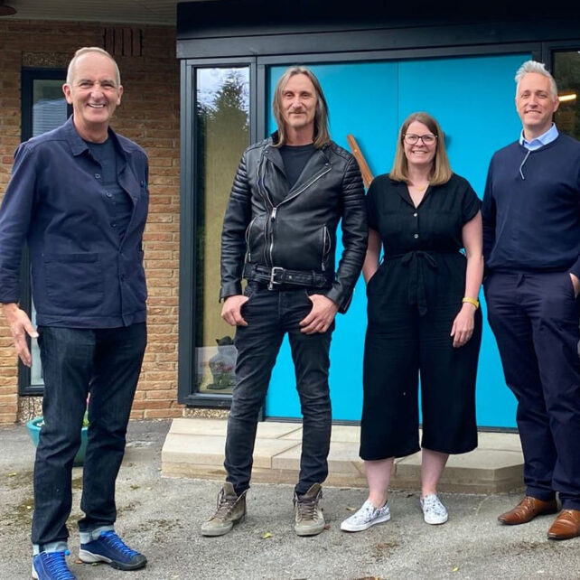 Claire Kemp and Howard Evans of CE+CA Architects in Sheffield with contractor Terry Huggett and TVs Kevin McCloud in front of multi-award winning retrofit project Ravine House in Derbyshire.